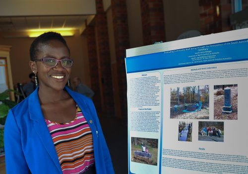 Student in front of poster presentation